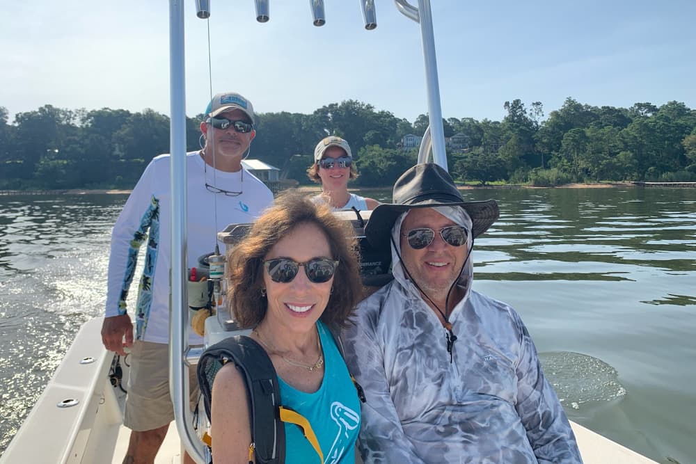 A group of people in a boat on the water