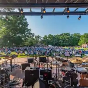 View from a stage showing a crowd enjoying an outdoor concert.