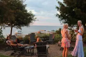 Guests around the firepit at Jubilee Suites in Fairhope, AL